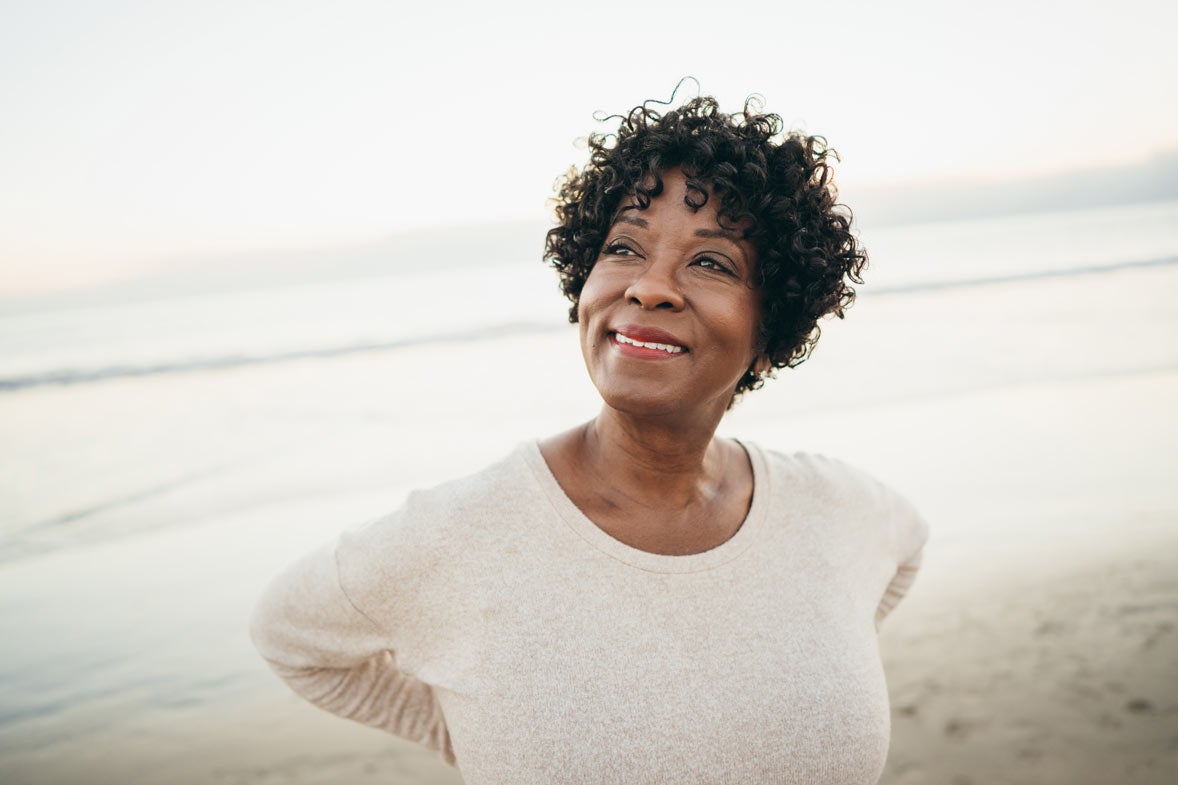 African American woman smiling and looking to the distance